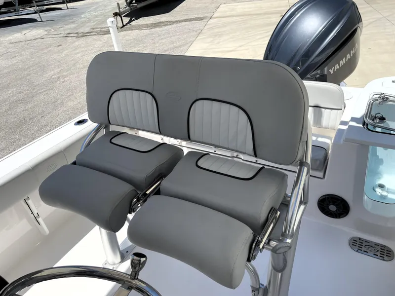 Slide: The Image of 2023 Sea Fox 228 Commander boat with dual gray cushioned seats and Yamaha engine. - 26