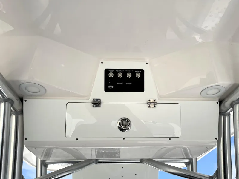 Slide: The Image of 2023 Sea Fox 228 Commander boat console with control panel and storage compartment. - 28
