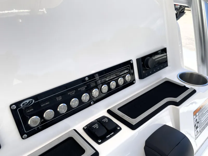 Slide: The Image of Control panel of 2023 Sea Fox 228 Commander boat with switches and cup holder. - 30