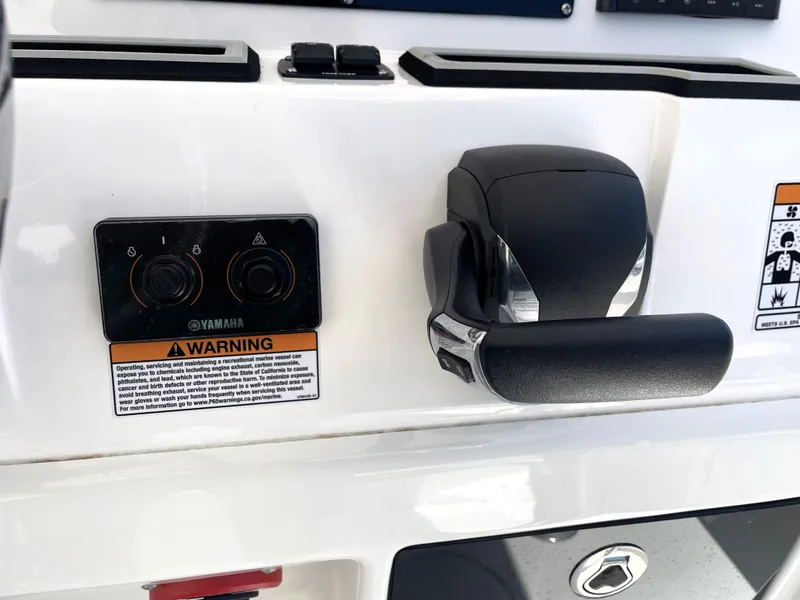 Slide: The Image of Control panel of 2023 Sea Fox 228 Commander boat with Yamaha throttle and warning label. - 32