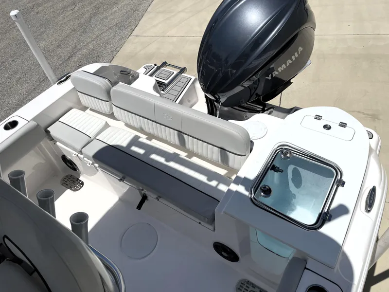 Slide: The Image of 2023 Sea Fox 228 Commander boat interior with Yamaha engine, featuring seating and storage. - 35