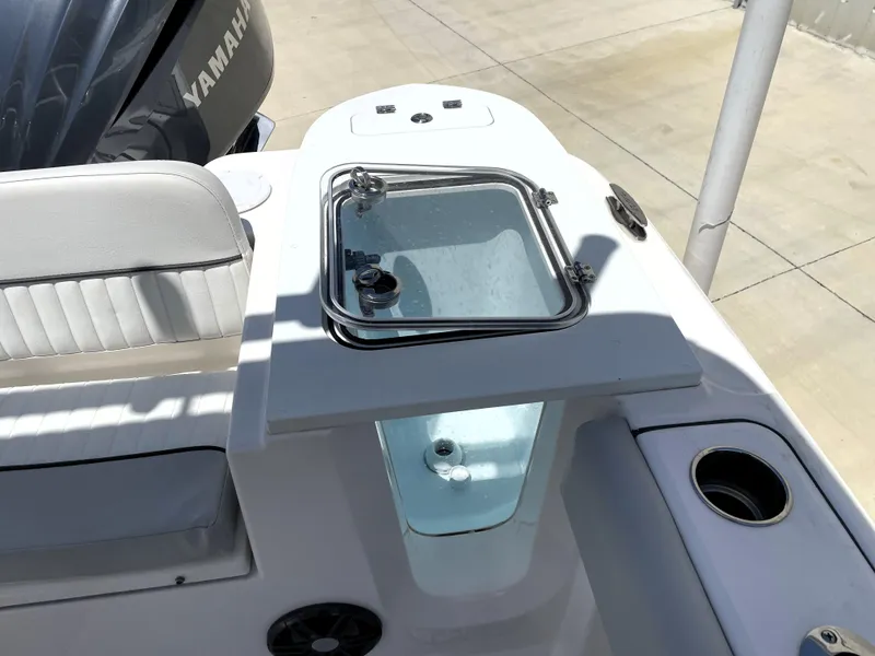 Slide: The Image of 2023 Sea Fox 228 Commander boat with Yamaha engine, featuring a livewell and seating area. - 37