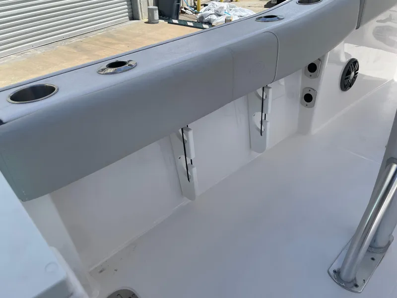 Slide: The Image of 2023 Sea Fox 228 Commander boat interior with rod holders and cushioned seating. - 41