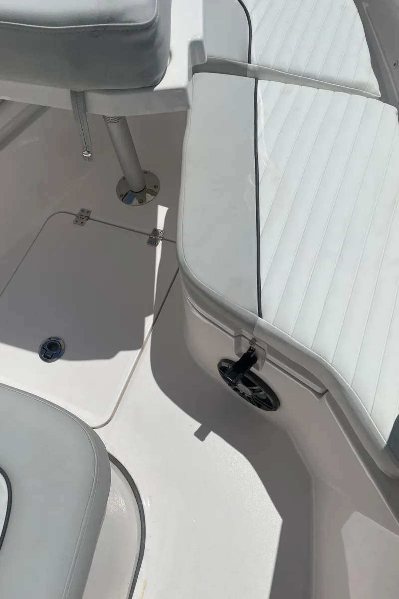 Slide: The Image of 2023 Sea Fox 228 Commander boat interior with white seating and deck details. - 43
