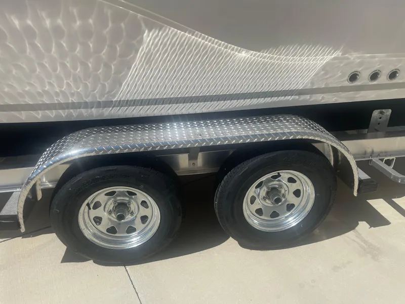 Slide: The Image of 2023 Sea Fox 228 Commander trailer with dual wheels and metallic fender. - 46