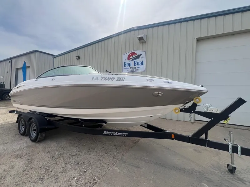 Slide: The Image of 2008 Chaparral 220 SSi boat on trailer outside Boji Boat Brokers building. - 1