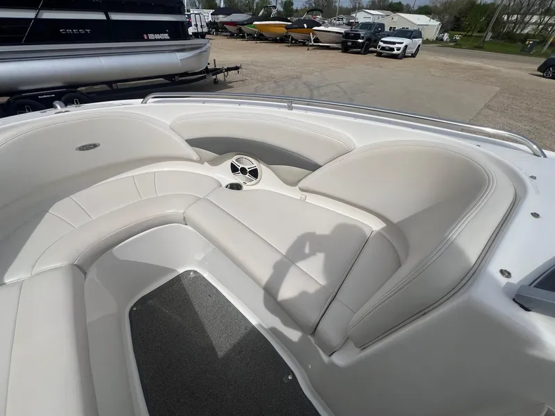 Slide: The Image of 2008 Chaparral 220 SSi boat interior with white seating and speaker. - 10