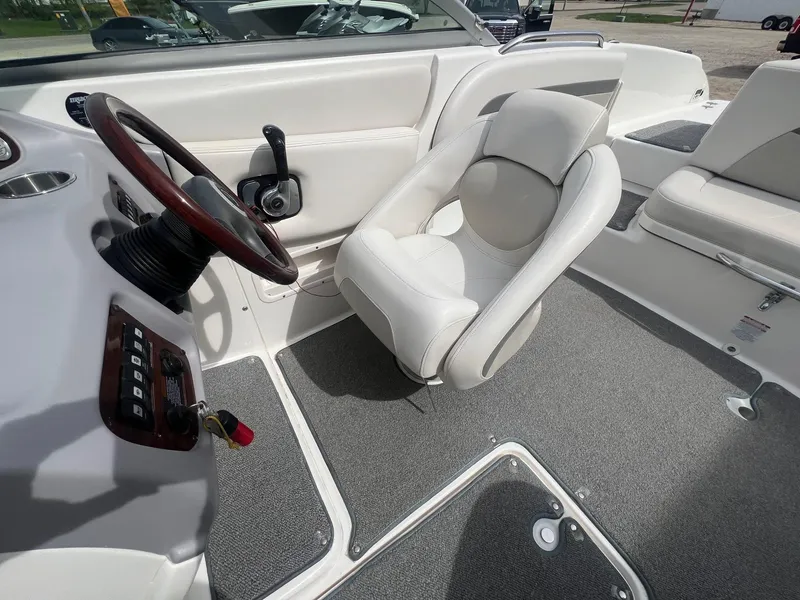 Slide: The Image of 2008 Chaparral 220 SSi boat interior with steering wheel and seating. - 12
