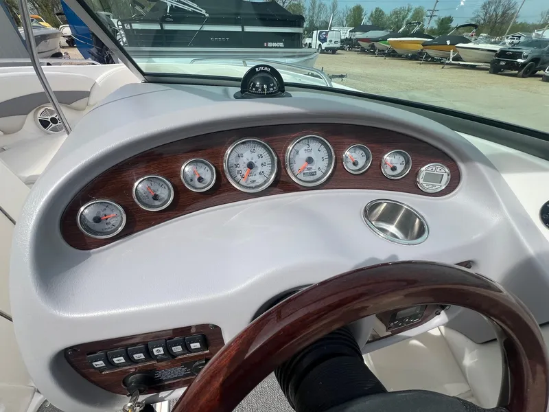 Slide: The Image of Dashboard of a 2008 Chaparral 220 SSi boat with gauges and controls. - 14