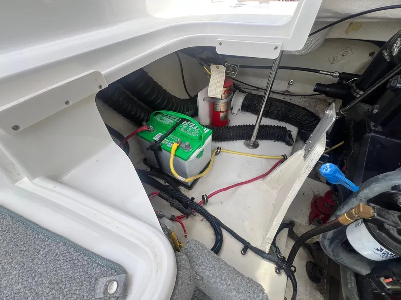 Slide: The Image of Engine compartment of 2008 Chaparral 220 SSi with battery and wiring. - 22