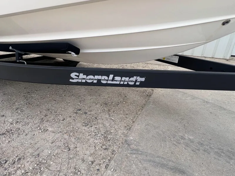 Slide: The Image of 2008 Chaparral 220 SSi boat on ShoreLand'r trailer, parked on concrete surface. - 29