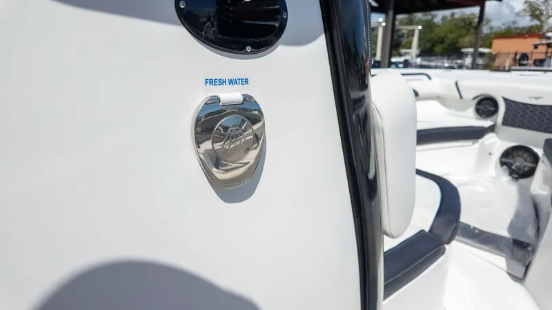 Slide: The Image of 2025 Tidewater 272cc boat interior with fresh water access feature. - 18