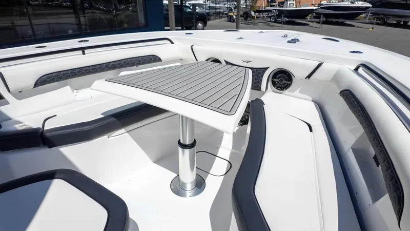 Slide: The Image of 2025 Tidewater 272cc boat interior with seating and table, showcasing modern design and comfort. - 20