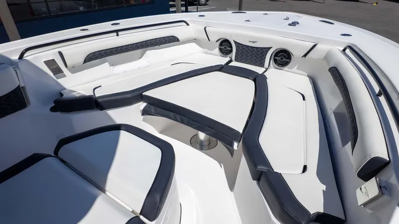 Slide: The Image of 2025 Tidewater 272cc boat interior with cushioned seating and modern design. - 21