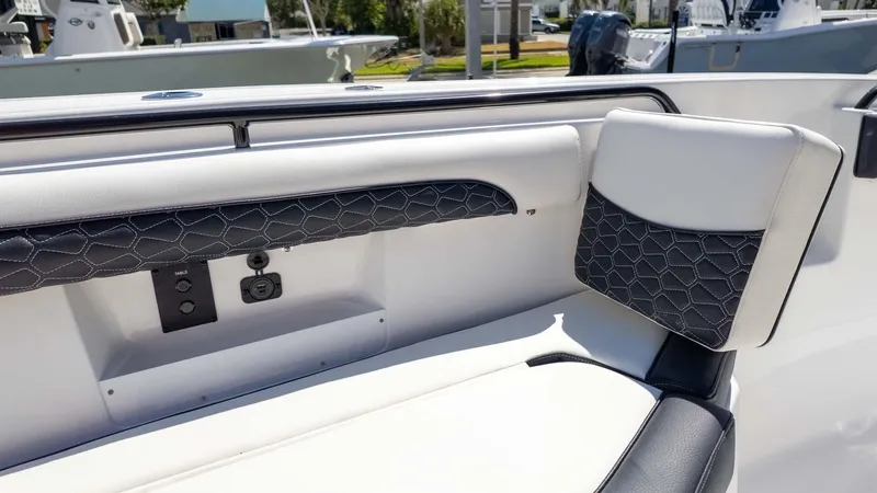 Slide: The Image of 2025 Tidewater 272cc boat interior with stylish seating and modern design elements. - 23