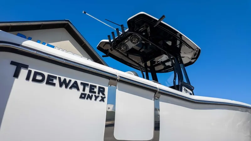 Slide: The Image of 2025 Tidewater 272cc boat with Onyx branding against clear blue sky. - 3