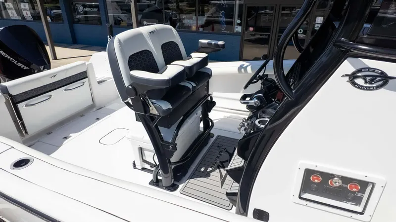 Slide: The Image of 2025 Tidewater 272cc boat interior with dual seats and control panel. - 9