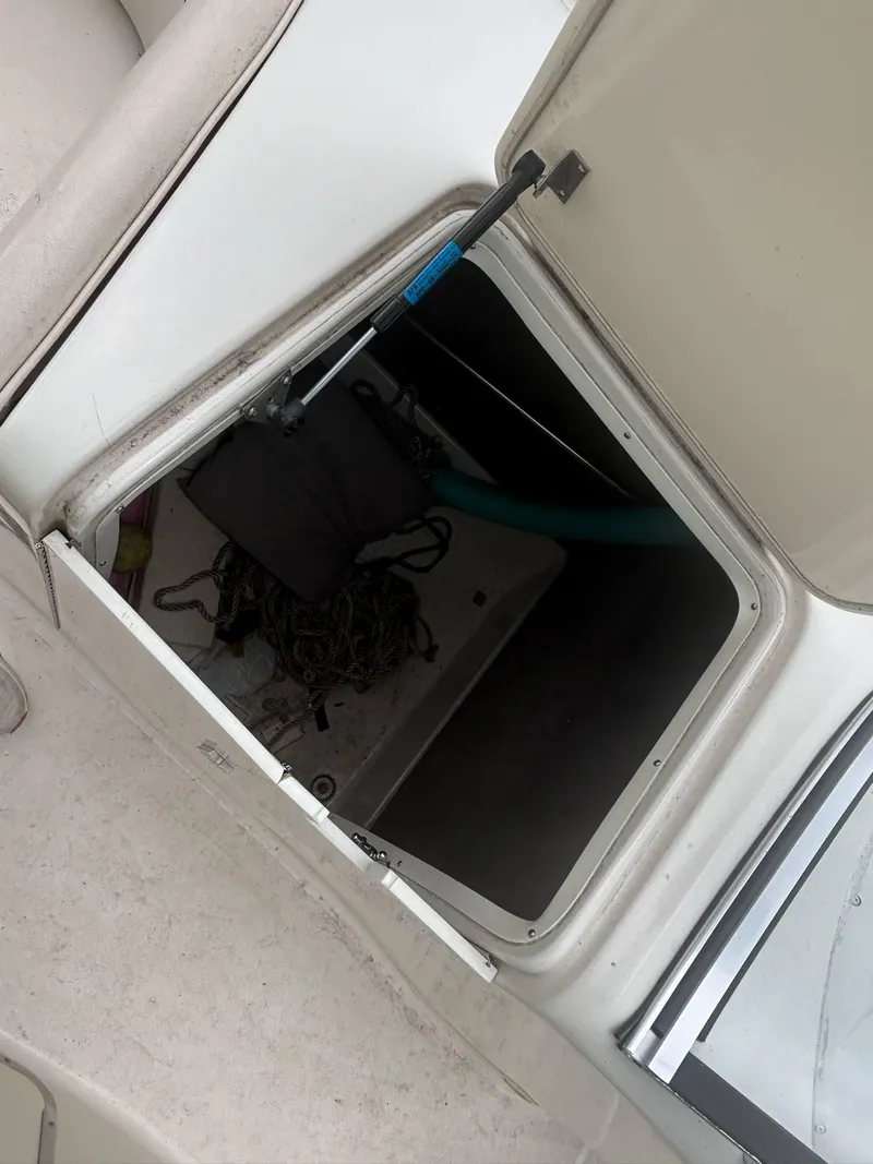 Slide: The Image of Open storage compartment on a 2000 Monterey 220 Explorer boat. - 7