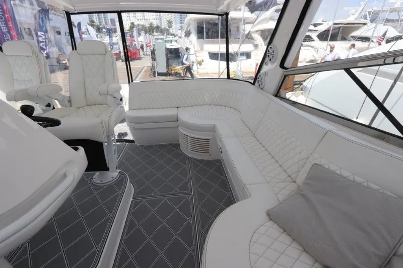 Slide: The Image of Luxurious interior of 2019 Intrepid 475 Sport Yacht with white seating and modern design. - 33