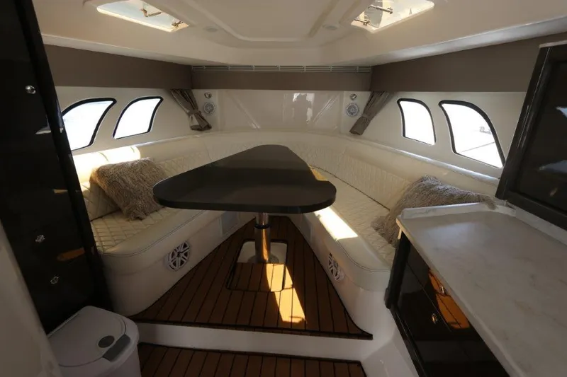 Slide: The Image of Luxurious interior of 2019 Intrepid 475 Sport Yacht with elegant seating and table. - 46
