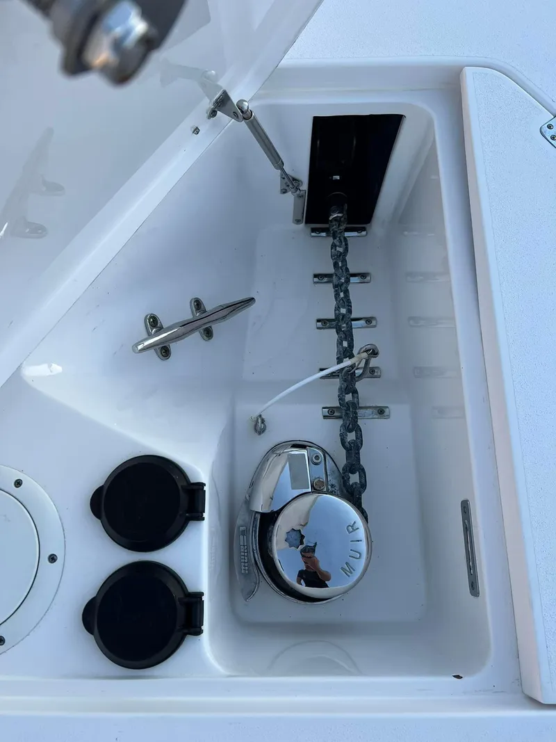 Slide: The Image of Anchor compartment of 2019 Intrepid 475 Sport Yacht with chain and cleat. - 6