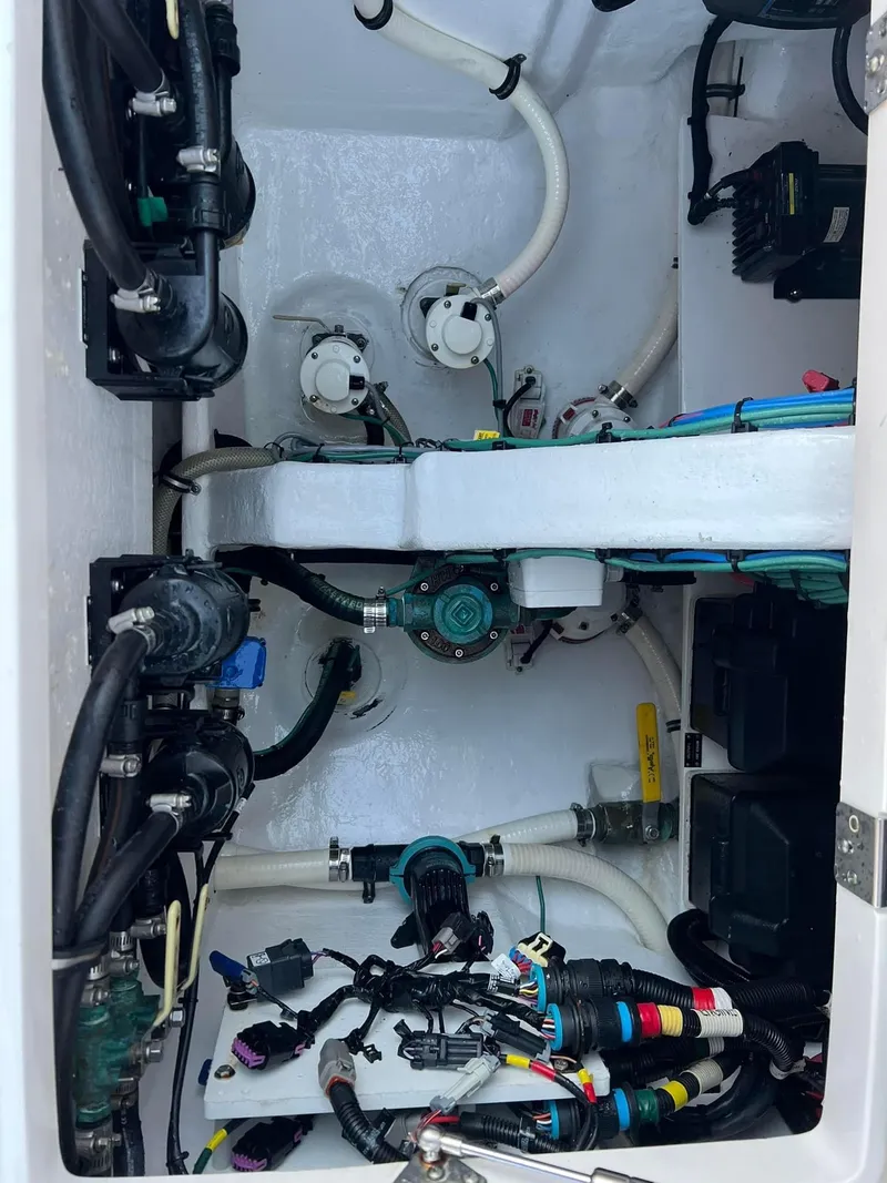 Slide: The Image of Engine compartment of a 2019 Intrepid 475 Sport Yacht, showcasing wiring and mechanical components. - 7