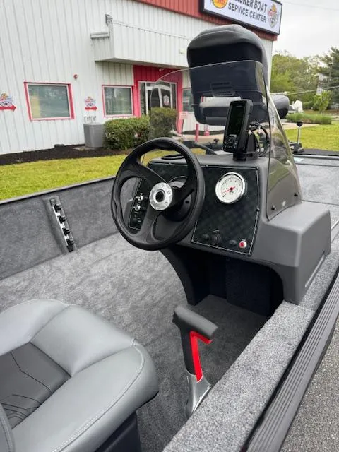 Slide: The Image of 2025 Tracker Bass Tracker Classic XL boat interior with steering console and seating. - 10