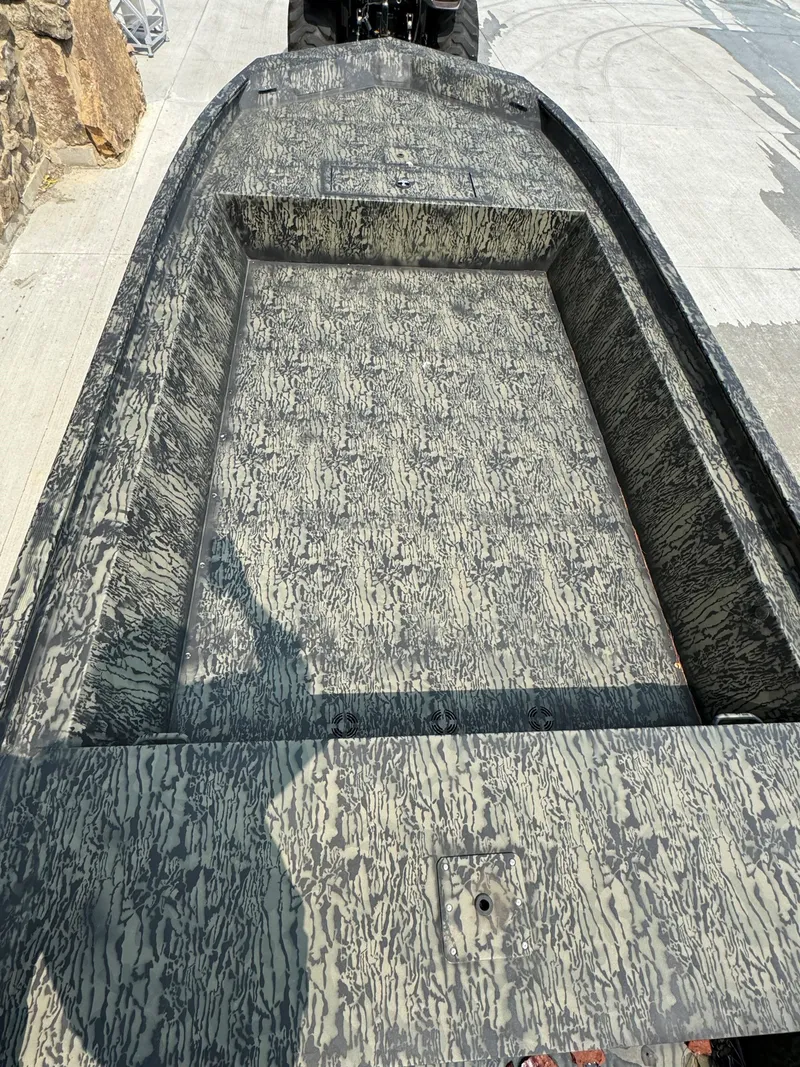 Slide: The Image of 2025 Tracker GRIZZLY 1860 Utility boat with camouflage interior design. - 3