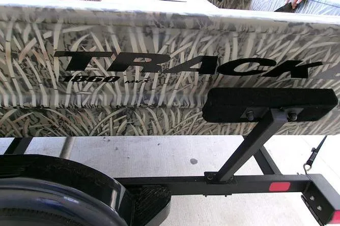 Slide: The Image of 2025 Tracker Grizzly 1860 Utility boat with camouflage design on trailer. - 7