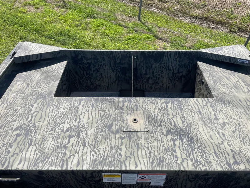 Slide: The Image of 2025 Tracker GRIZZLY 1860 Utility boat with camouflage pattern, viewed from above. - 10