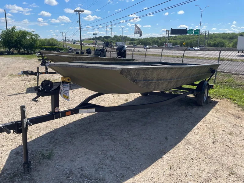 Slide: The Image of 2025 Tracker GRIZZLY 1860 Utility boat on trailer in outdoor lot. - 3