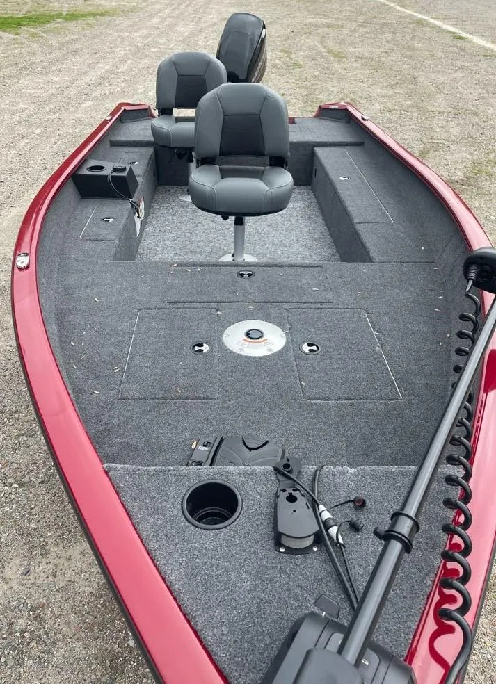 Slide: The Image of 2025 Tracker Super Guide V-16 T boat with red exterior and dual seating. - 3