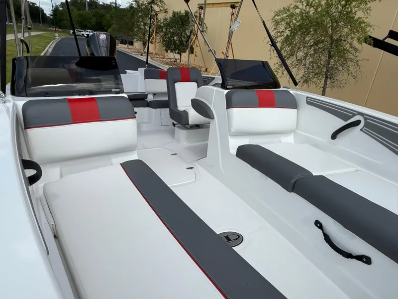Slide: The Image of 2025 Tahoe T21 boat interior with gray and red seating, sleek design, and modern features. - 4