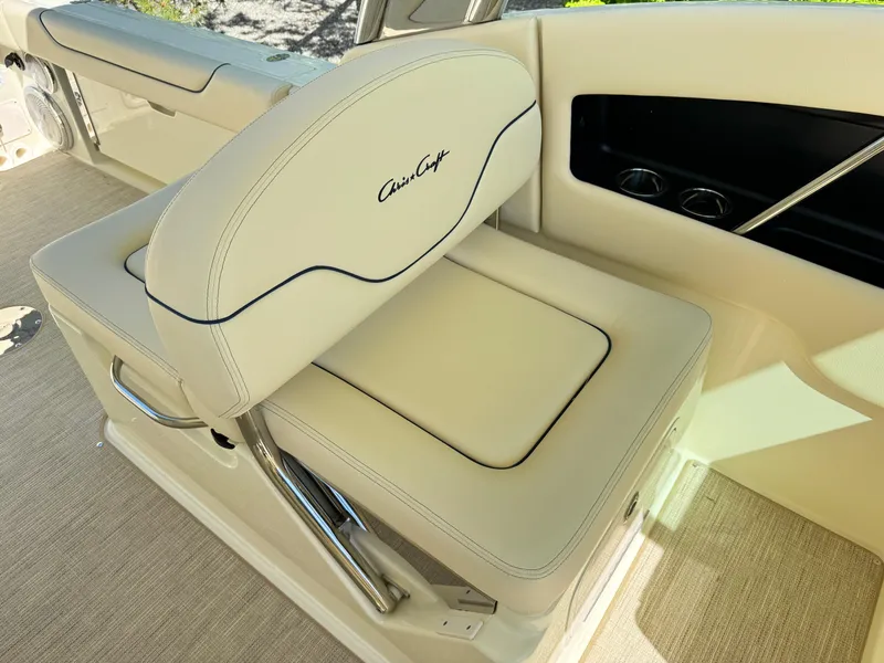 Slide: The Image of 2025 Chris-Craft Calypso 28 boat seat with elegant beige upholstery and chrome accents. - 15