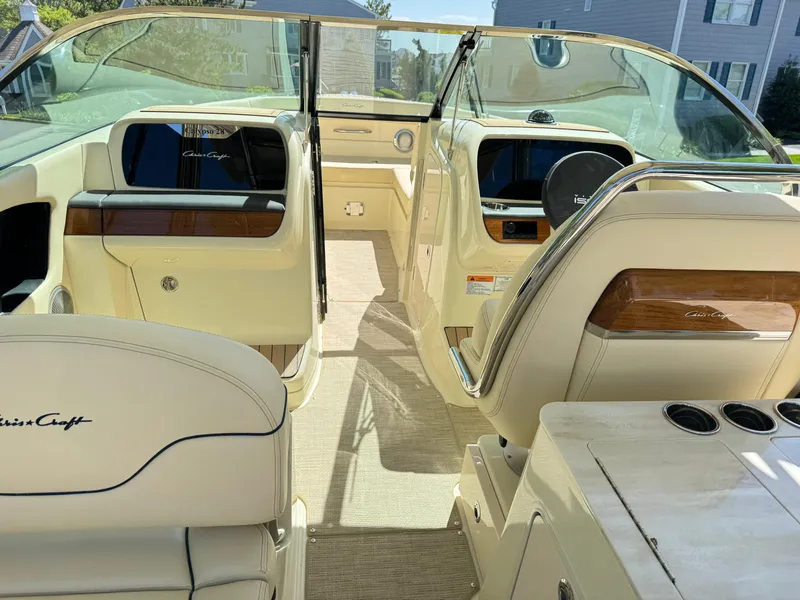 Slide: The Image of 2025 Chris-Craft Calypso 28 boat interior with luxurious seating and modern dashboard. - 18