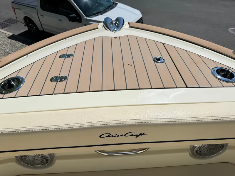 Slide: The Image of 2025 Chris-Craft Calypso 28 boat deck with teak finish and chrome fittings. - 33