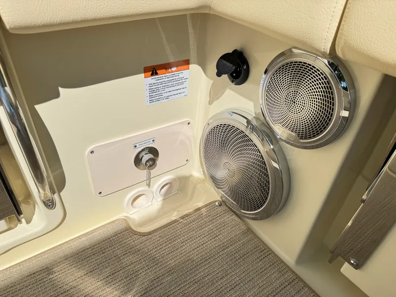 Slide: The Image of 2025 Chris-Craft Calypso 28 interior with speakers and control panel. - 6