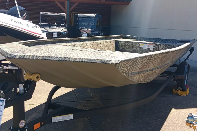 The Image of 2025 Tracker GRIZZLY 1860 Utility boat on trailer, outdoor display. - 0