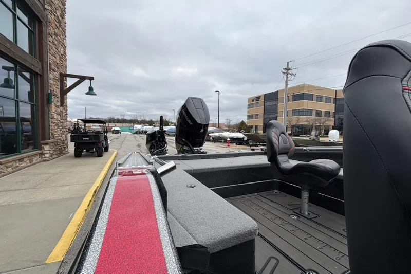 Slide: The Image of 2024 Nitro ZV21 Pro boat with sleek design, parked outdoors near buildings. - 101