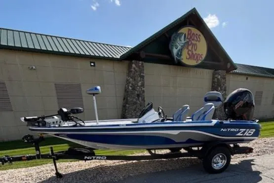The Image of 2025 Nitro Z18 Pro boat with blue and white design, parked outdoors. - 0