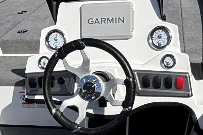 Slide: The Image of 2025 Nitro Z18 Pro boat with powerful outboard motor, parked on concrete surface. - 3