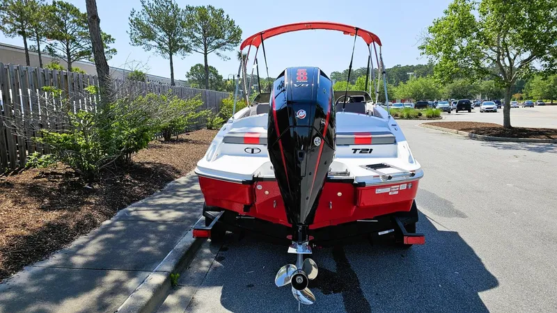 Slide: The Image of 2025 Tahoe T21 boat with outboard motor parked on a sunny street. - 12