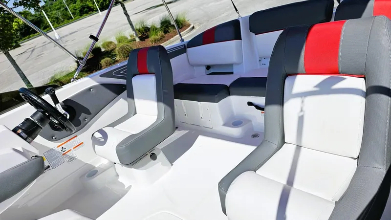 Slide: The Image of 2025 Tahoe T21 boat interior with modern seating and steering wheel. - 9