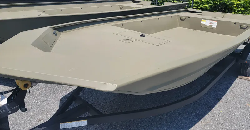 Slide: The Image of 2025 Tracker GRIZZLY 1860 Utility boat on trailer, outdoor display. - 3