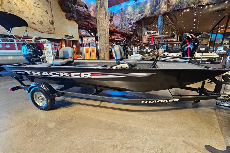 The Image of 2025 Tracker Panfish 17 boat with Mercury engine on trailer, parked outdoors. - 0
