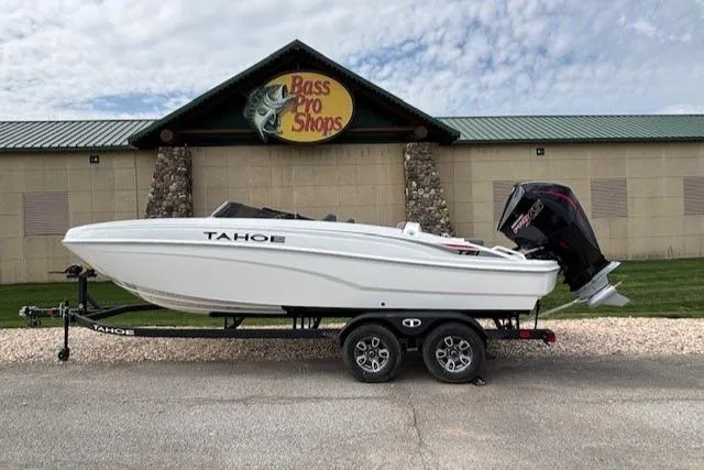 The Image of 2025 Tahoe T21 boat on trailer outside Pro Shops, featuring sleek design and powerful engine. - 0