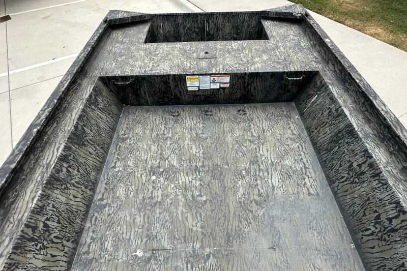 Slide: The Image of 2025 Tracker Grizzly 1860 Utility boat interior with camouflage pattern. - 20