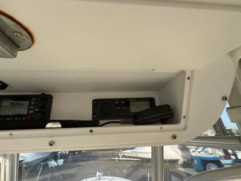 Slide: The Image of 2015 Ocean Runner 2900 boat radio equipment in storage compartment. - 10