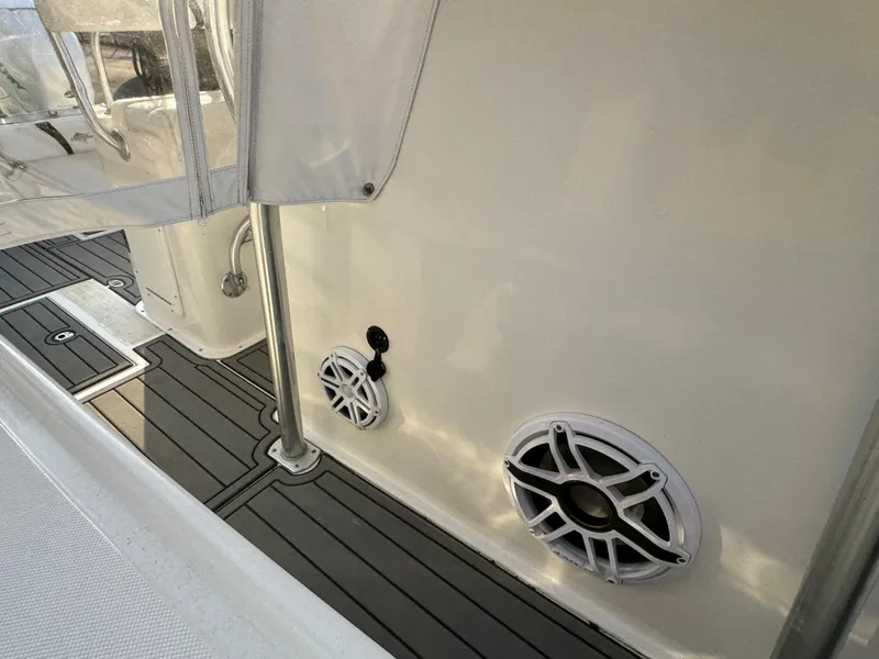 Slide: The Image of 2015 Ocean Runner 2900 boat interior with speakers and sleek flooring. - 15