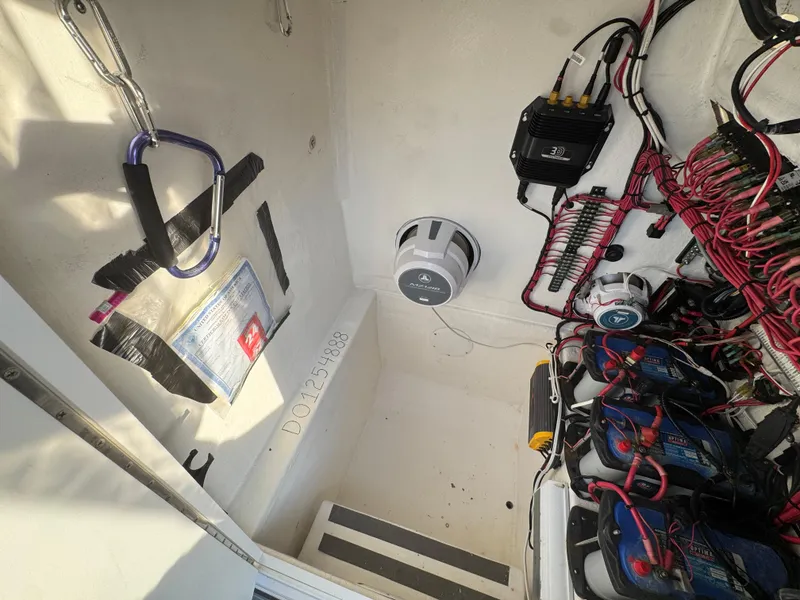 Slide: The Image of Electrical system setup in a 2015 Ocean Runner 2900 boat, featuring wiring and components. - 19